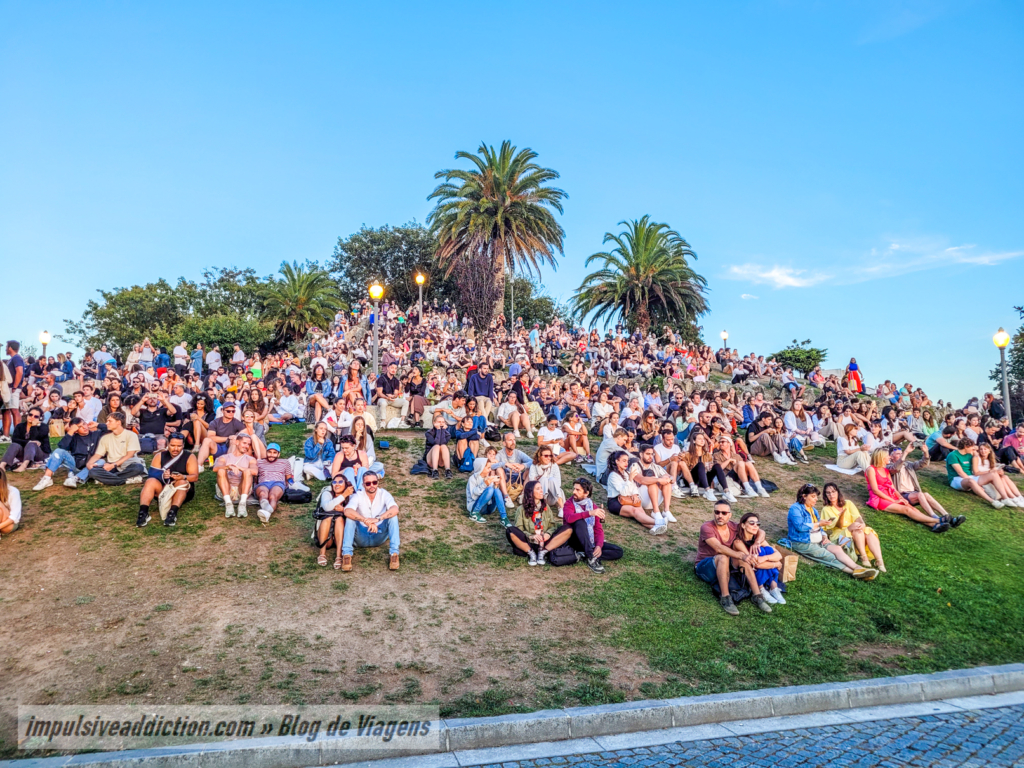 Crowd watching the sunset in Jardim do Morro