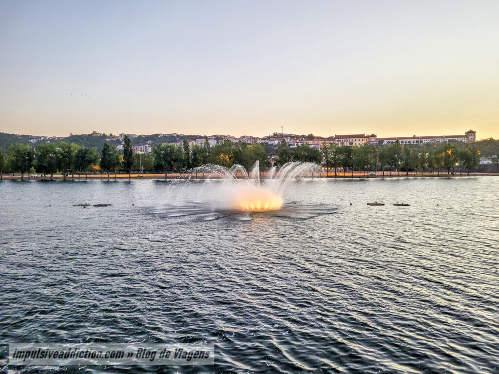 Luminous Fountain on Mondego River at dusk